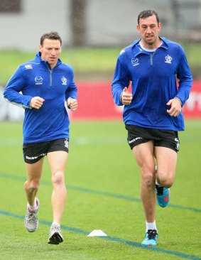 North Melbourne's Brent Harvey and Todd Goldstein train at Arden Street on Monday.