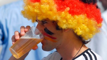 Level-headed: A German fan enjoys a beer at the football. 