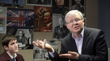 Kevin Rudd spoke to students at a school with posters of Hitler and Mussolini on the wall.