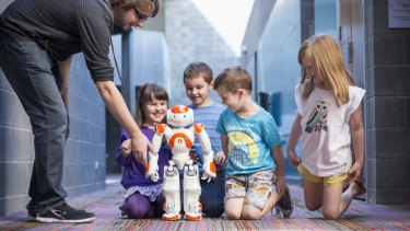 Neo Robot children for Robotronica Nao robot and children, with PhD student Gavin Suddrey.
