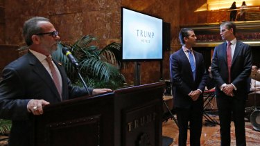 Eric Danziger, head of Trump's hotels division, speaks as Donald Trump Jr, centre, and Eric Trump (right) glance around the room at an event to launch the new chain at Trump Tower this week.