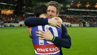 Full of heart: Injured Bulldogs skipper Bob Murphy embraces his stand-in, Easton Wood, after the Bulldogs beat GWS.