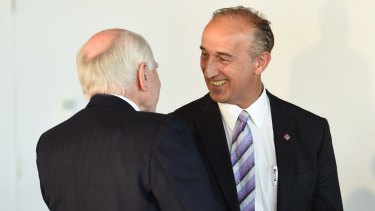 Walter Mikac greets former PM John Howard at a lunch for gun control in September 2015.