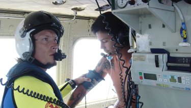 A 20-year-old man receives care aboard an RACQ Careflight helicopter after being bitten by a shark while on a tuna boat 100 nautical miles off Coolangatta.