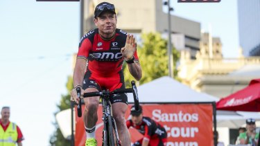 Cadel Evans waves to the crowd during the presentation of teams ahead of the 2015 Tour Down Under.