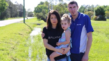 Jessica and Ryan Baker with their daughter Ociana, 3, outside their Salt Ash home. The family had to "doctor shop" for blood tests. 