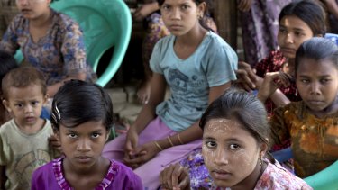 Ethnic Rohingya girls sit at a refugee camp north of Sittwe, western Rakhine state, Myanmar. 