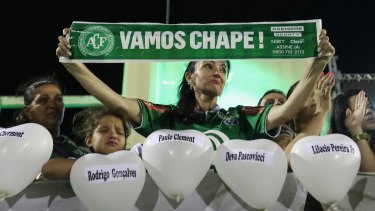 Fans paying tribute to the team in Chapeco, in the southern Brazilian state of Santa Catarina, on Wednesday, with balloons featuring the victims' names and a banner that reads "Let's go Chape".