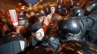 Protesters try to break through a riot police cordon during a rally in St. Petersburg on  Saturday. 