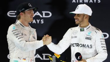Rare moment of grace: Rosberg is congratulated by teammate and rival Lewis Hamilton.