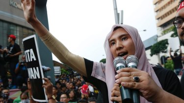 Lawmaker and a vice-president of the People's Justice Party Nurul Izzah Anwar, daughter of oppression leader Anwar Ibrahim, speaks to protesters in 2015. 