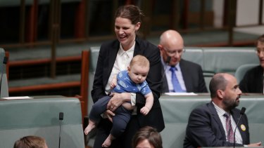 Labor MP Kate Ellis with 4-month-old Charlie during a division in the House of Representatives on Monday.