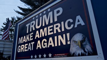 A campaign sign for Donald Trump is displayed on a trailer in Nashua, New Hampshire.