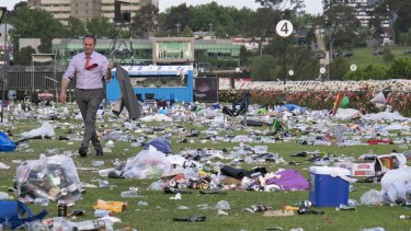 Racegoers leave Flemington a huge mess, leaving the last to go to wade through an ocean of rubbish.