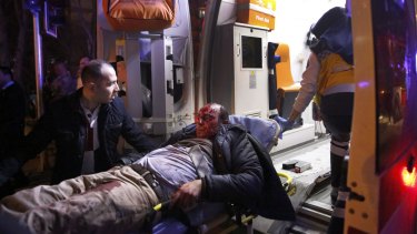 Paramedics carry a wounded man from the site of an explosion in Ankara on  Wednesday.