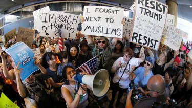 Demonstrators gather outside Los Angeles International Airport.