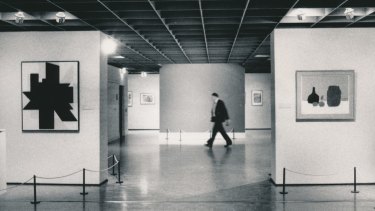 A NGV guard walks past the bare wall where Picasso's Weeping Woman had hung.
