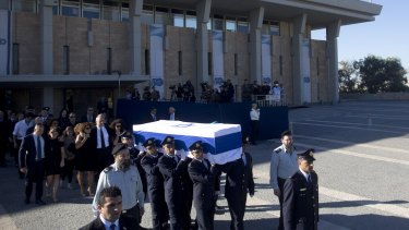 Family members of former Israeli president Shimon Peres follow his coffin at the Knesset, Israel's parliament.