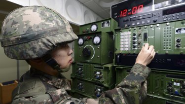 A South Korean soldier adjusts equipment used for the propaganda broadcasts at a studio near the border between South Korea and North Korea in Yeoncheon, South Korea, on Friday.