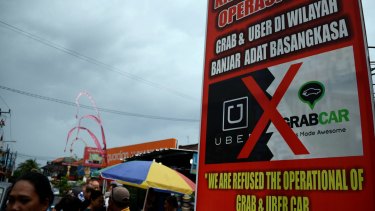 Uber defies Bali ban, offers free car rides and chopper trips