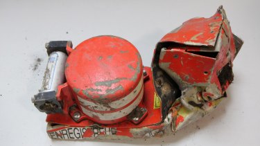 This photo shows the damaged voice data recorder of the Germanwings jetliner. The second black box, with the flight data recorder, has been found in the French Alps.