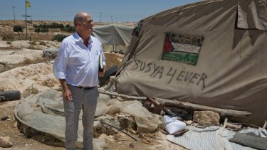 Irish author Colm Toibin visits what remains of the Palestinian village of Susiya in the Israeli-occupied West Bank in July.