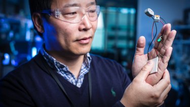 Jun Chen demonstrates wearable tech at the Australian Institute for Innovative Materials Intelligent Polymer Research Institute.