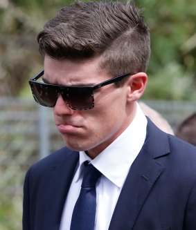 Sean Abbott walks with the procession following Phillip Hughes' funeral in Macksville.