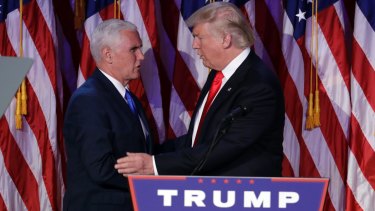 President-elect Donald Trump, right, shakes hands with Vice-President-elect Mike Pence during his victory party.