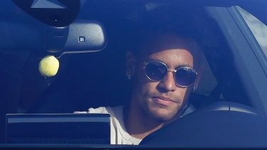 Brazil striker Neymar arrives at Barcelona's training grounds on Wednesday.