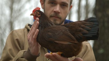 Brian Caraker believes in singing to his chickens.
