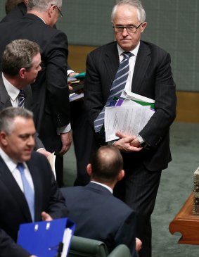Communications Minister Malcolm Turnbull and Prime Minister Tony Abbott at the end of question time.