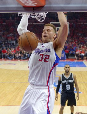No stopping that: Los Angeles Clippers forward Blake Griffin dunks as San Antonio Spurs guard Patty Mills watches during Game 7.