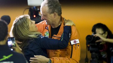 Swiss pilot Andre Borschberg (right) embraces his wife Yasemin before taking off from Japan en route to Hawaii.