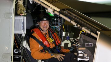Swiss pilot Andre Borschberg sits in the cockpit of the Solar Impulse 2 before its planned departure from Nagoya Airport in Japan.