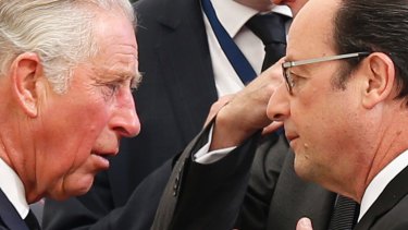 Britain's Prince Charles, left, and French President Francois Hollande talk prior to the funeral.