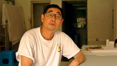 Activist Wu Guijun posing in his office in Shenzhen, south China's Guangdong province. 