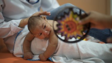 Three-month-old Daniel, who was born with microcephaly, undergoes physical therapy at the Altino Ventura foundation in Recife, Brazil. 