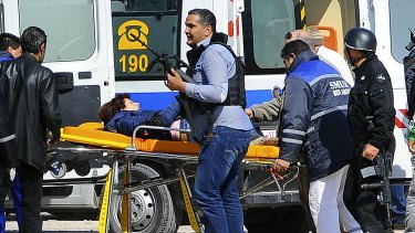 A victim is evacuated outside the Bardo Musum in Tunis.