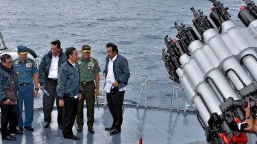 Indonesian President Joko Widodo, third from right, on the deck of an Indonesian navy warship in the waters of the Natuna Islands.