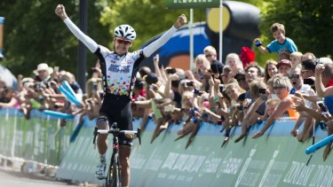 Triumphant: Tour of Utah champion Lachlan Morton raises his arms in the air as he crosses the finish line.