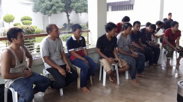 In this photo provided by the Office of Sulu Governor, freed Indonesian tugboat crewmen in Jolo, Sulu province, southern Philippines on Sunday.