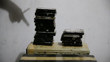 Computer hard drives gathered by members of the Philippines' National Bureau of Investigation anti-human trafficking division during a raid at Deakin's residence.