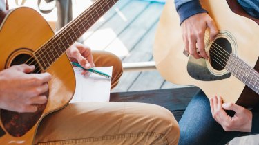 A hobby such as playing the guitar can form the basis of a 'side hustle'.