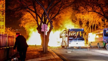 Turkish army service busses burn after an explosion on Wednesday.