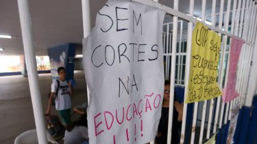 Students occupy the Elefante Branco high school in Brasilia, Brazil. The sign says "No cuts to education". 