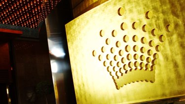 The accused man was escorted from the gaming floor of Crown Casino.