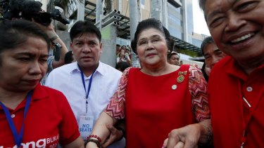 Former First Lady and now Congresswoman Imelda Marcos, centre, arrives to lend support to her son vice-presidential candidate Bongbong Marcos.