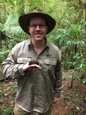 QUT's Dr Andrew Baker with a threatened Black-tailed Antechinus.