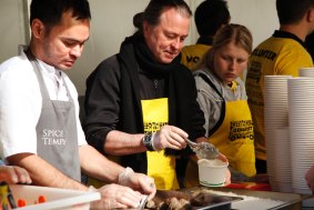 Neil Perry (second from left) is teaming with OzHarvest to serve soup to the masses. 